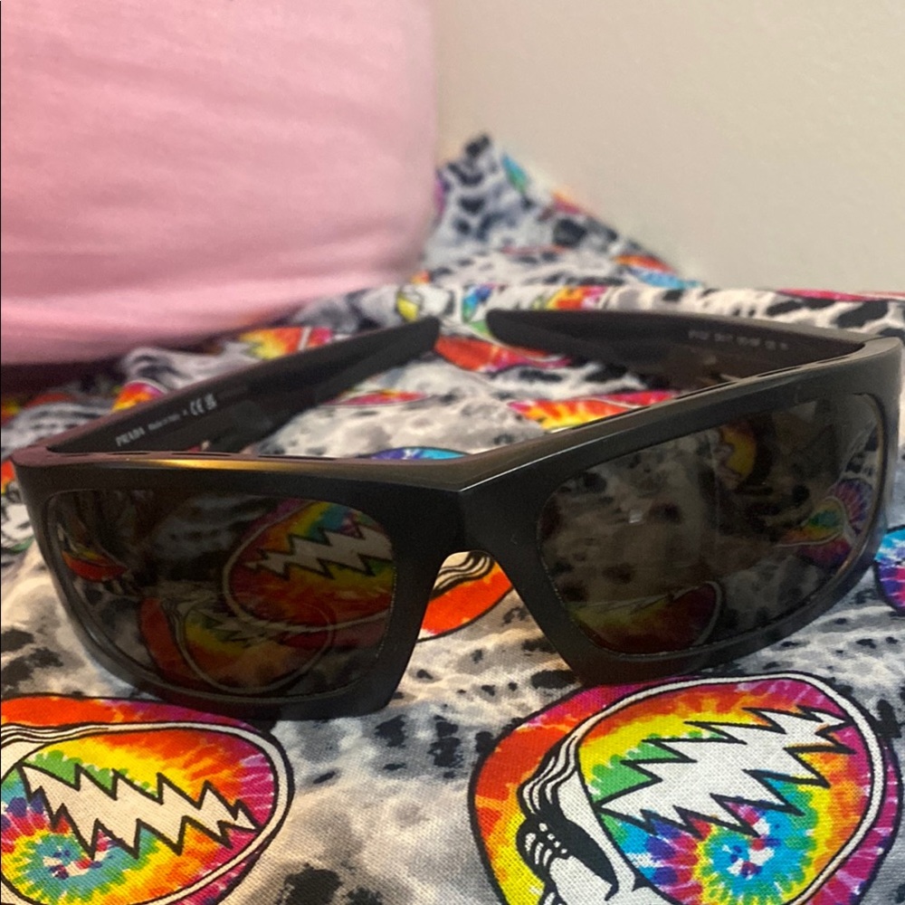 Prada Black Sunglasses with Sporty Frame and Dark Lenses